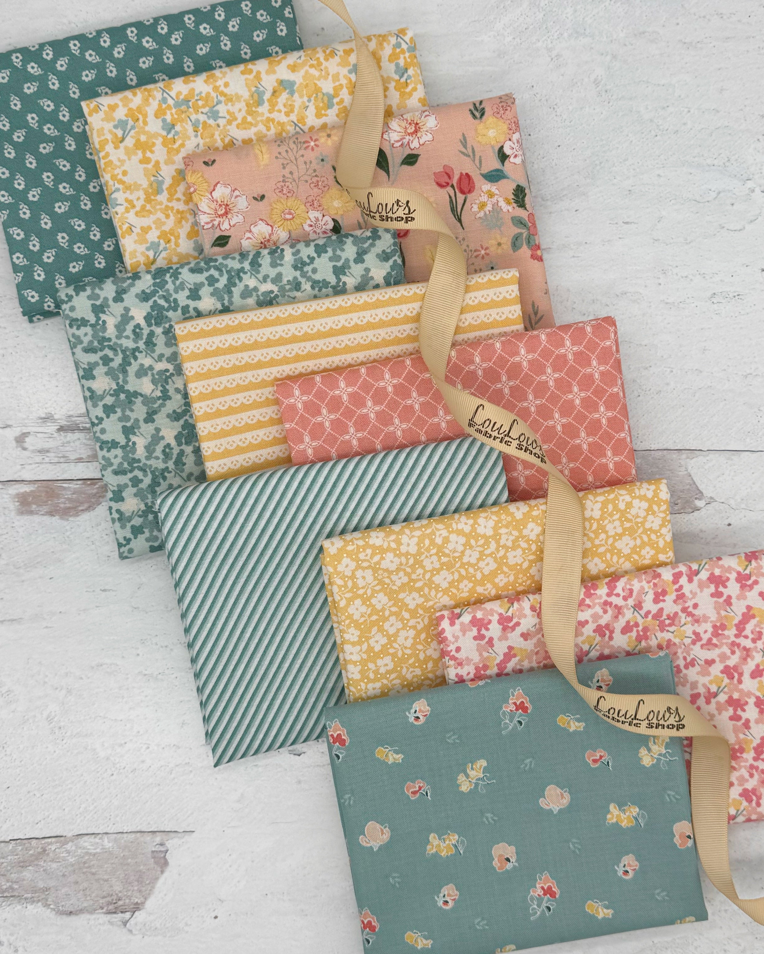 10 fat quarters in soft spring teals, yellows and pinks. Florals and geometrics. 