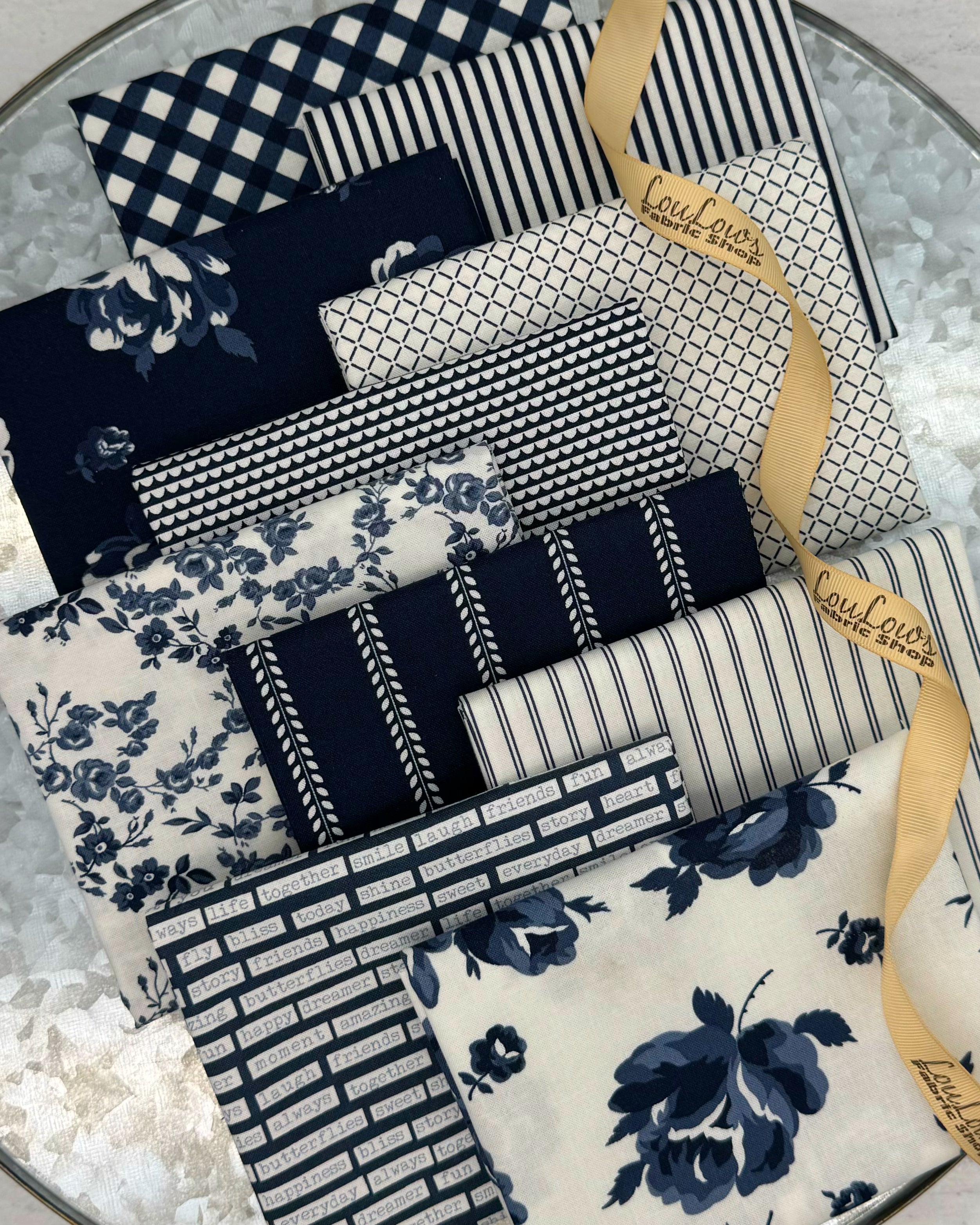10 fat quarters in off white and rich, dark navy in florals, stripes and ginghams. 