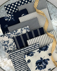 10 fat quarters in off white and rich, dark navy in florals, stripes and ginghams. 