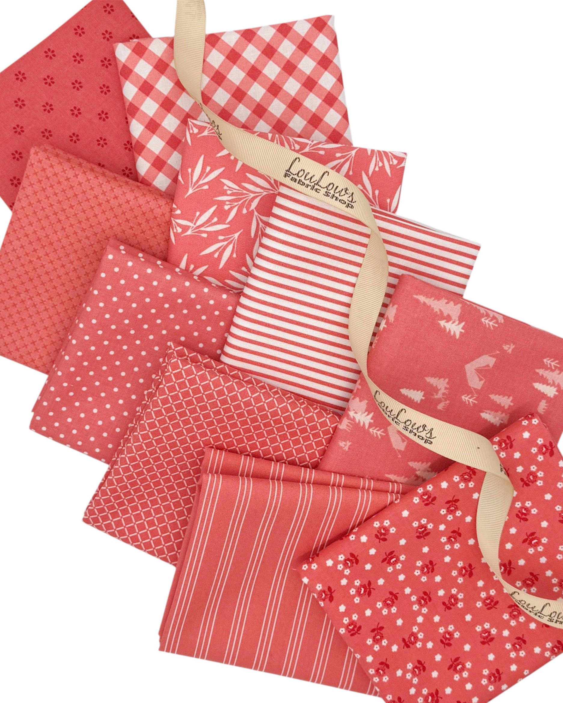 10 brightly muted pink fat quarters in florals, stripes, geometrics and ginghams. 