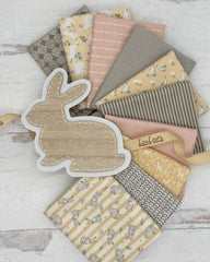 10 fat quarters in muted shades of yellow, grey and pink. Several have bunnies, ducks and have a general Easter theme. 