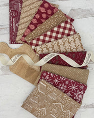 10 fat quarters- 5 with a gingerbread color background and 5 with a mulberry colored background with gingerbread men and winter prints. 