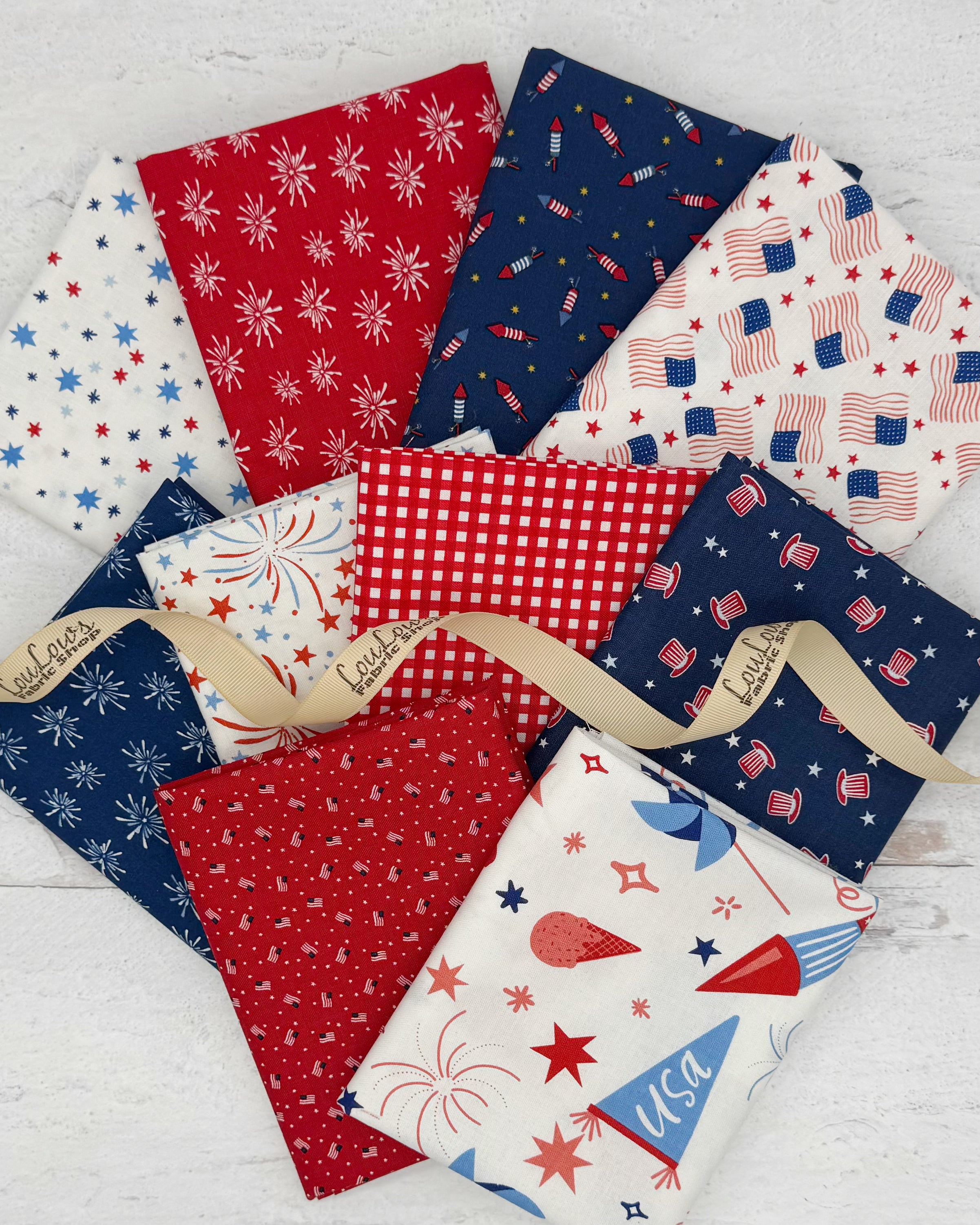 Collection of 10 fat quarters with red, white and navy backgrounds. All with patriotic prints. 