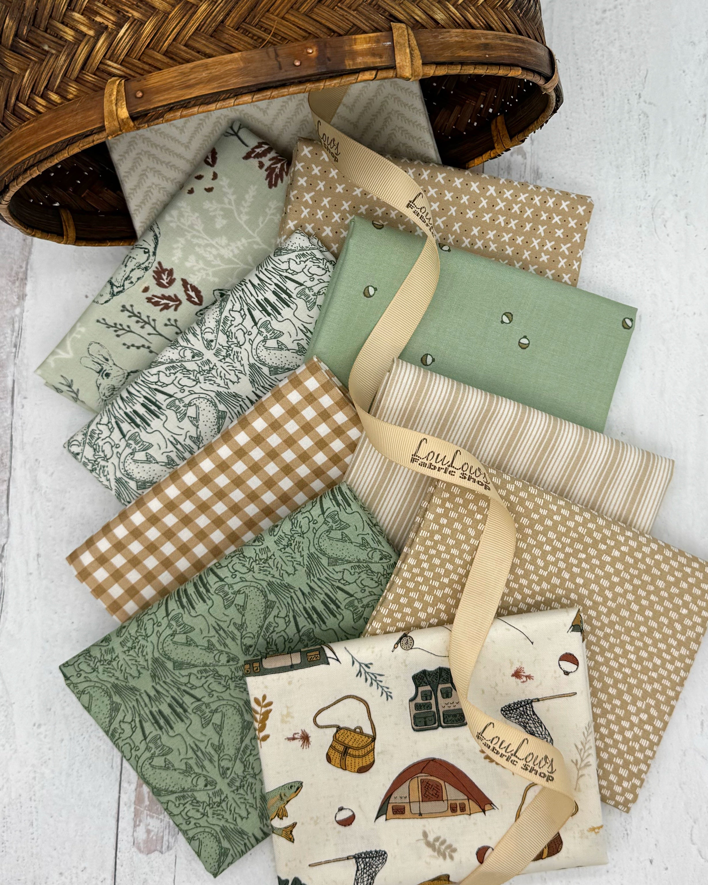 Collection of 10 fat quarters in sage greens, creams and tans with a subtle fishing theme. 