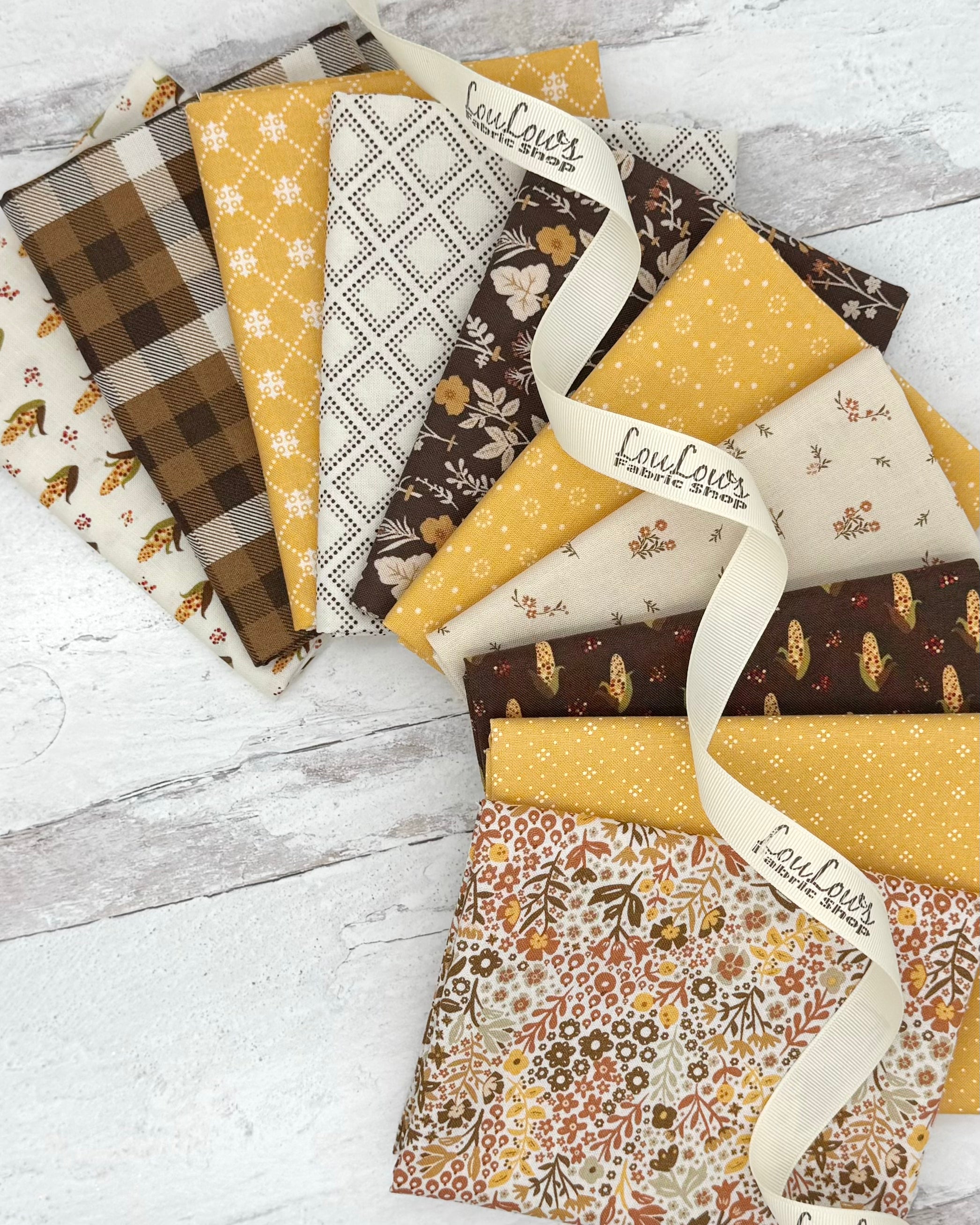 Collection of 10 fat quarters in creams, golds and browns all with an autumn feel. Dots, geometrics, plaids and florals. 