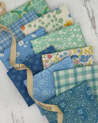 10 fat quarters in sea foam greens and coastal blues with floral and plaid prints. 