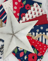 Connection of 10 fat quarters in reds, whites and navies with an island feel. 