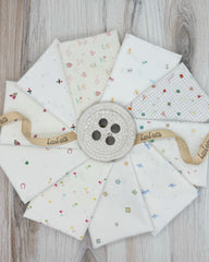 10 fat quarters in low volume spring prints on an off white background. 