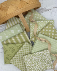 Selection of 10 pistachio hued fabrics in florals, stripes, lattice and script patterns. 