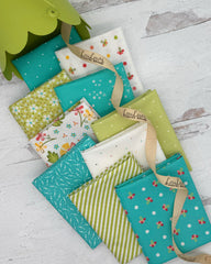 Collection of 10 fat quarters in bright aqua, white and soft apple green fabrics in florals, stripes and geometrics. 