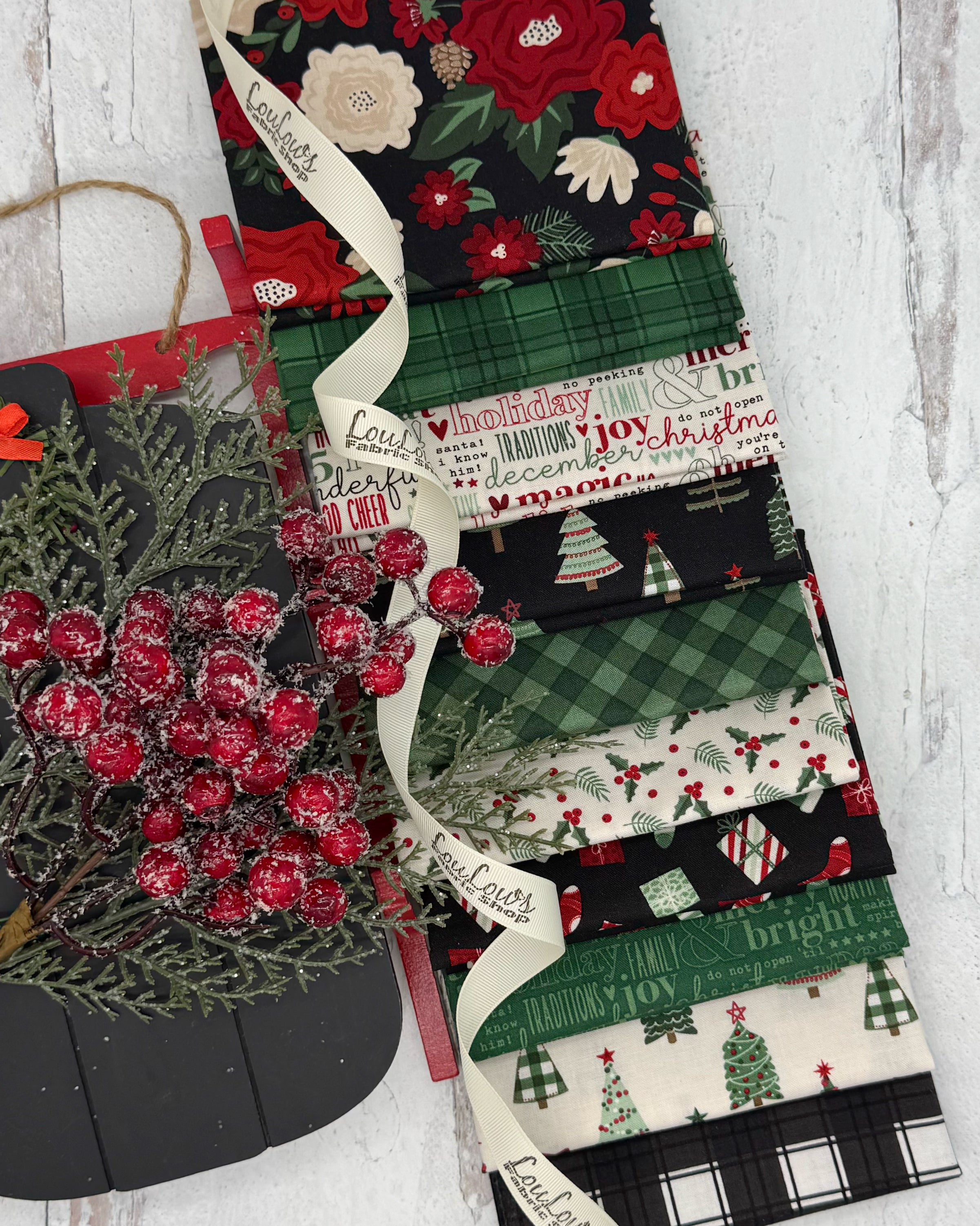 10 fat quarters in deep greens, creams and blacks all with a farmhouse Christmas feel. Plaids, trees, holly and words. 