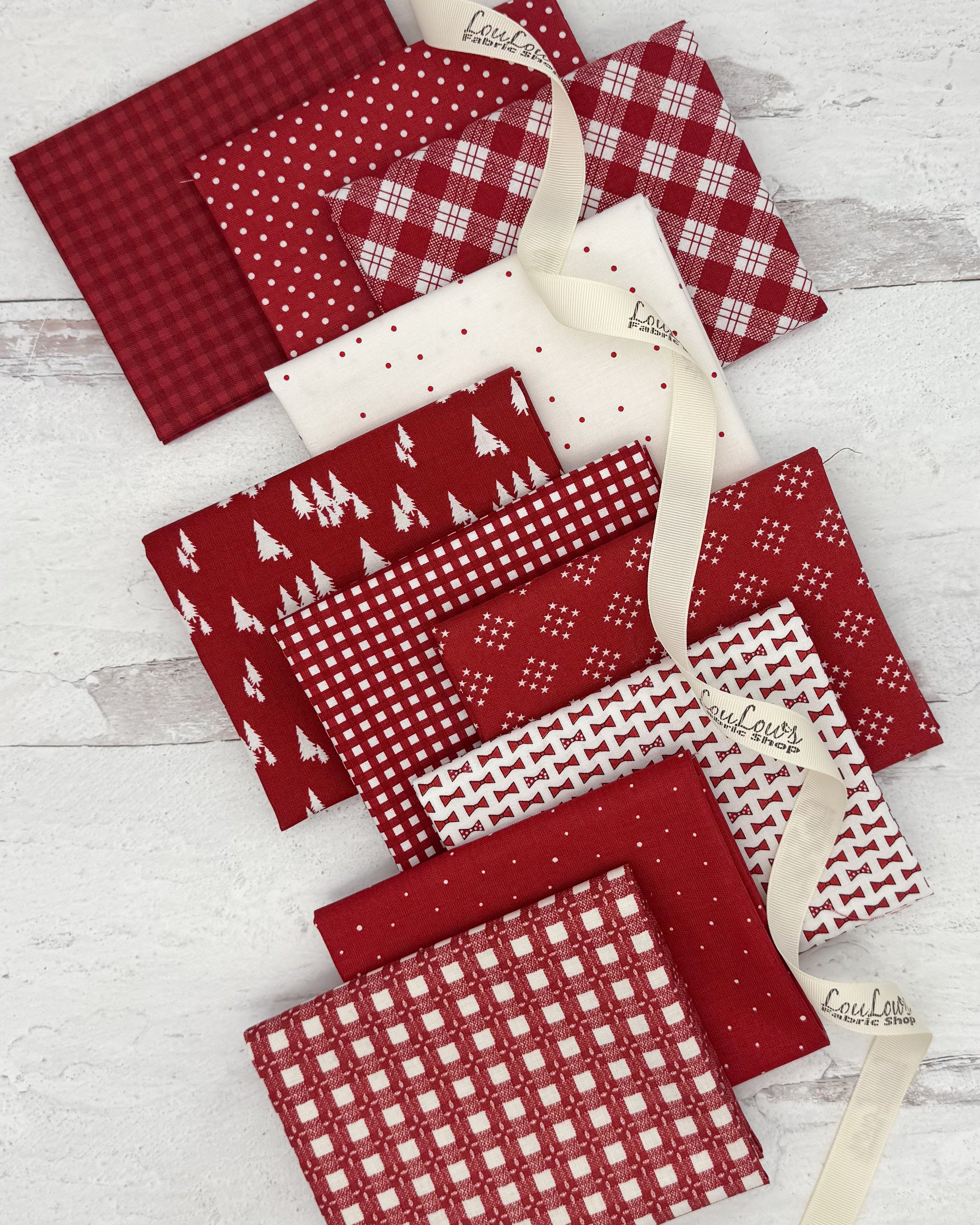 10 fat quarters in a dark red with prints of ginghams, geometrics and dots. 