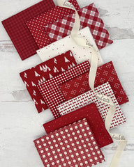 10 fat quarters in a dark red with prints of ginghams, geometrics and dots. 