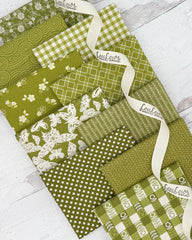 Collection of 10 olive green fat quarters with prints of ginghams, butterflies, geometrics and florals. 