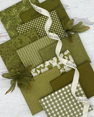 10 olive green fat quarters with geometric, woodland and nature prints. 