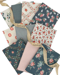 10 Fat Quarters in dusty blue, off white and pinks. Geometrics and florals 